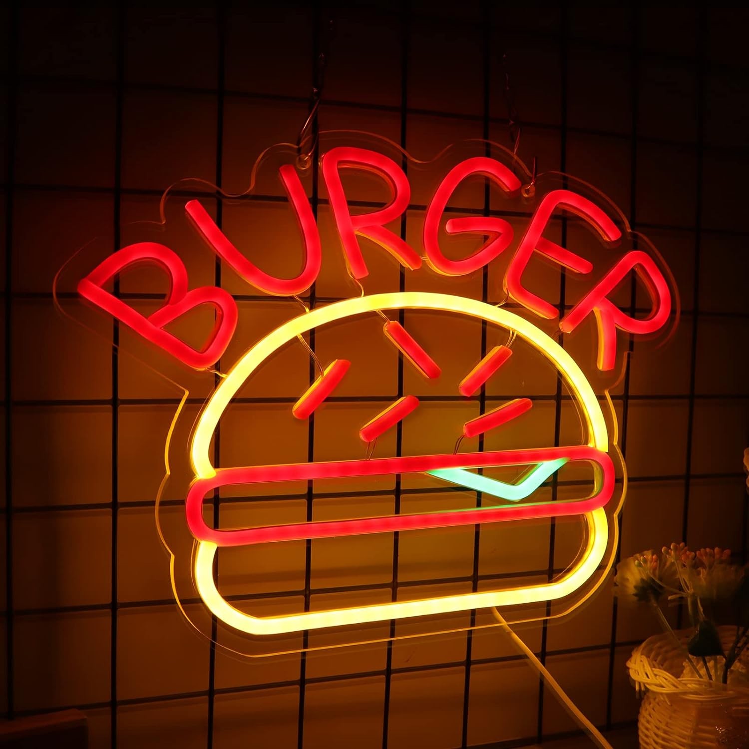 burgerbelysning neonskylt logotyp på väggen